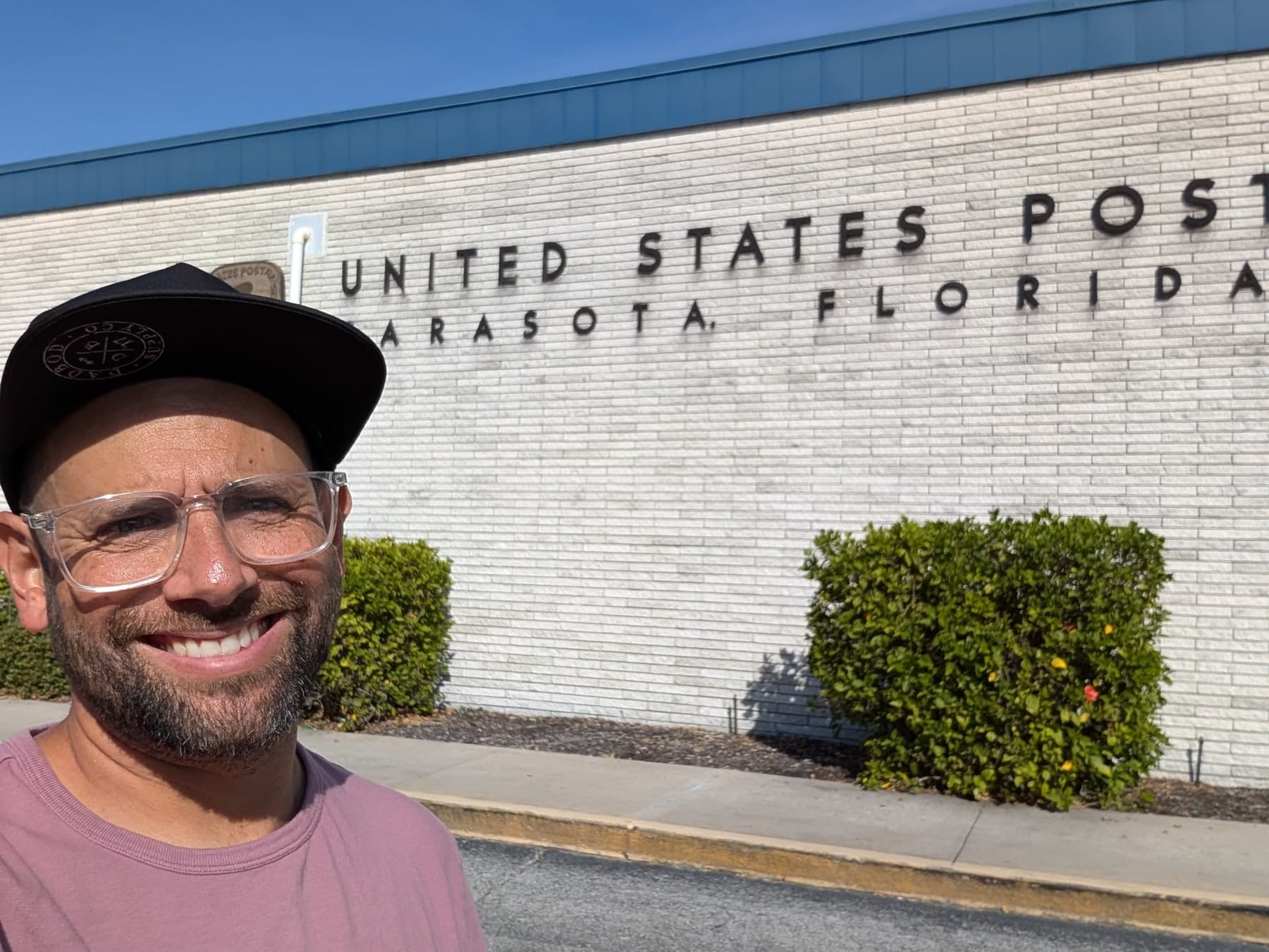 Kason outside a USPS location while working on route planning